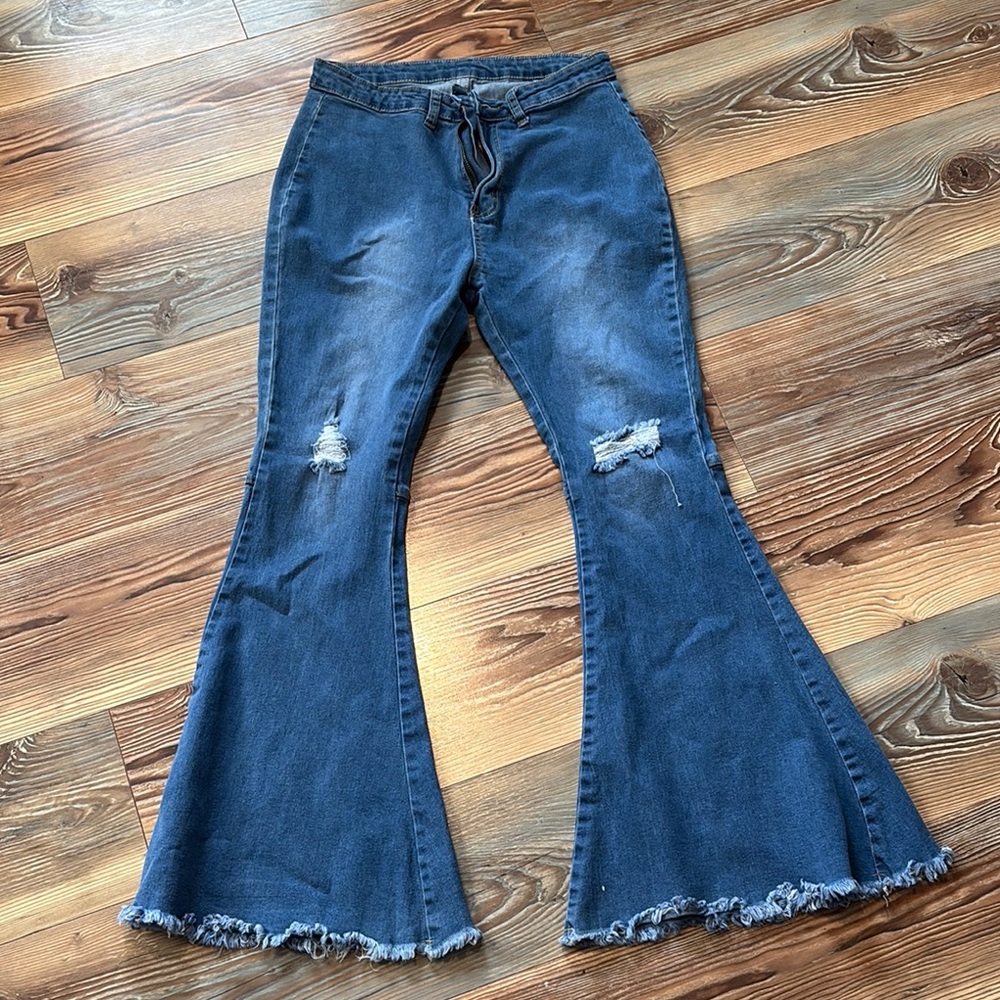 Flared Blue Jeans with Distressed Details